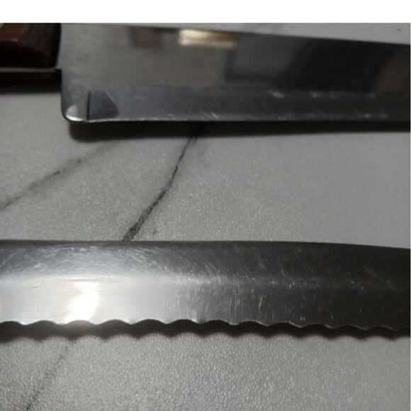 Pair of stainless steel Knives by Flint made in USA Surface scratches Partial